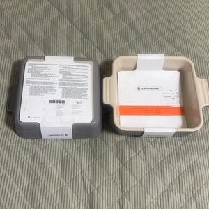 Brand New Le Creuset 5 1/2” square grey baking dish that holds 20oz each, 2 sets